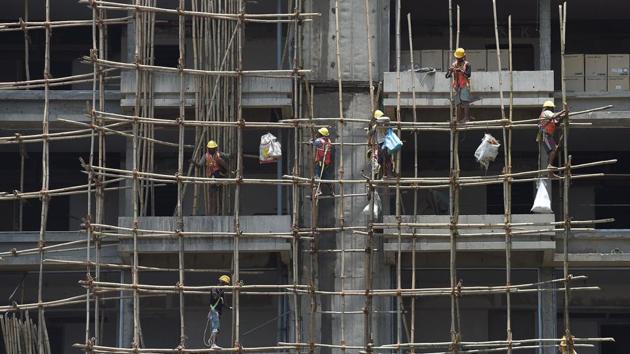 Indian constructors work at a site of an upcoming high-rise building in Mumbai.(AFP Photo)