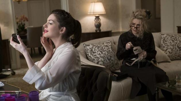 This image released by Warner Bros. shows Anne Hathaway, left, and Helena Bonham Carter in a scene from Ocean's 8.(AP)
