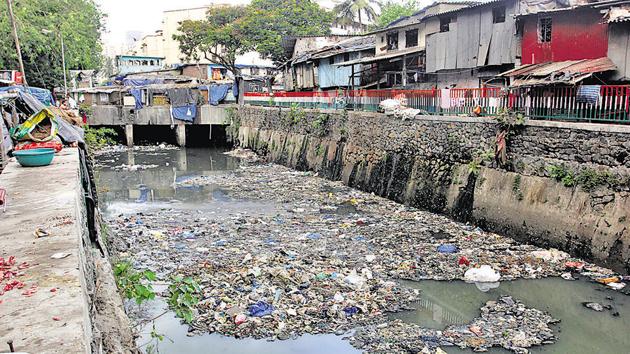 Floating garbage was spotted in Dharavi nullah.(HT)