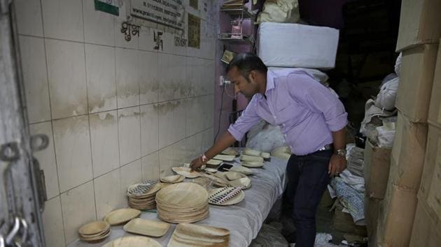Vaibhav Jaiswal inspects products at his warehouse. “In this entire process, we are not harming the environment,” said Bardhan. “We are generating something from the waste... and then it goes back as a waste.” While Prakritii initially made most of its income from Europe and the US, Bardhan said the Indian market is growing, especially among younger people who value quality over price. (Altaf Qadri / AP) Vaibhav Jaiswal inspects products at his warehouse. “In this entire process, we are not harming the environment,” said Bardhan. “We are generating something from the waste... and then it goes back as a waste.” While Prakritii initially made most of its income from Europe and the US, Bardhan said the Indian market is growing, especially among younger people who value quality over price. (Altaf Qadri / AP)