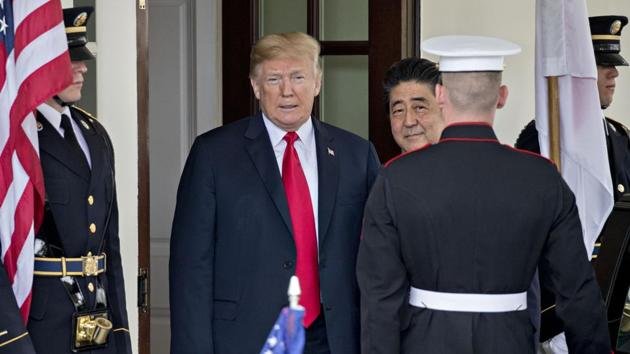 US President Donald Trump, left, and Shinzo Abe, Japan's prime minister, stand for photographs at the West Wing of the White House in Washington, DC.(Bloomberg)