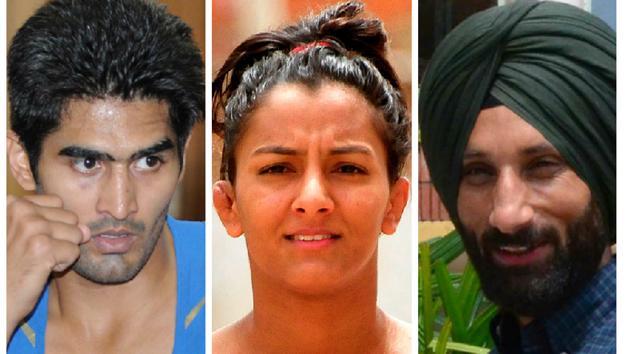 (Left to right) Vijender Singh, Geeta Phogat and Sardara Singh.(HT Photo)