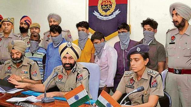The six arrested in police custody as commissioner of police Sukhchain Singh Gill during a press conference at Community Police Resource Centre (CPRC) in Ludhiana on Thursday.(HT Photo)
