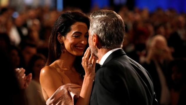 Actor George Clooney kisses his wife and human right lawyer Amal Clooney at the 46th AFI Life Achievement Award Gala in Los Angeles.(REUTERS) Actor George Clooney kisses his wife and human right lawyer Amal Clooney at the 46th AFI Life Achievement Award Gala in Los Angeles.(REUTERS)