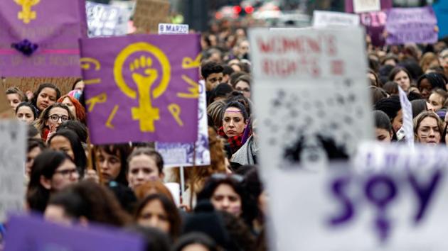 Demonstrators hold placards at the Puerta del Sol square during a one day strike to defend women’s rights on International Women's Day 2018 in Madrid. With nearly twice as many women as men in ministerial posts, the new socialist government has emerged from a strong feminist movement that permeates all areas of society and made itself felt in the unprecedented women’s strike earlier this year. (Oscar Del Pozo/ AFP File)