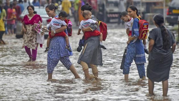 Heavy rain Thusday left streets submerged under water. Water-logging was reported in several areas including Malabar Hill and Hindmata, Dharavi, Byculla, Dadar TT, Kabutarkhana at Dadar, King Circle, Nagpada, Santacruz (East) and Marol Maroshi. (Shashank Parade / PTI) Heavy rain Thusday left streets submerged under water. Water-logging was reported in several areas including Malabar Hill and Hindmata, Dharavi, Byculla, Dadar TT, Kabutarkhana at Dadar, King Circle, Nagpada, Santacruz (East) and Marol Maroshi. (Shashank Parade / PTI)