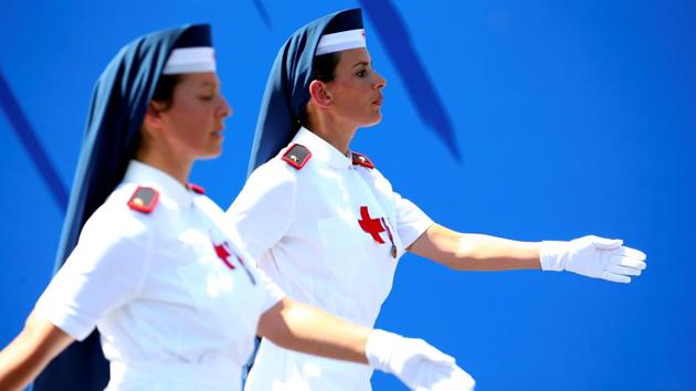 Italian Red Cross nurses march during the Republic Day military parade in Rome, Italy. (Tony Gentile / REUTERS)