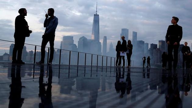 The skyline of downtown Manhattan is seen as people gather on the runway before the Saint Laurent Men's Spring/Summer 2019 collection presentation in Liberty State Park in New Jersey. (Andrew Kelly / REUTERS)