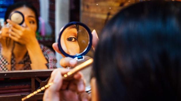 A performance artist prepares hair and makeup backstage before a nightly performance at Phare: The Cambodian Circus in Siem Reap, Cambodia. (Lauren DeCicca / Getty Images for LUMIX)