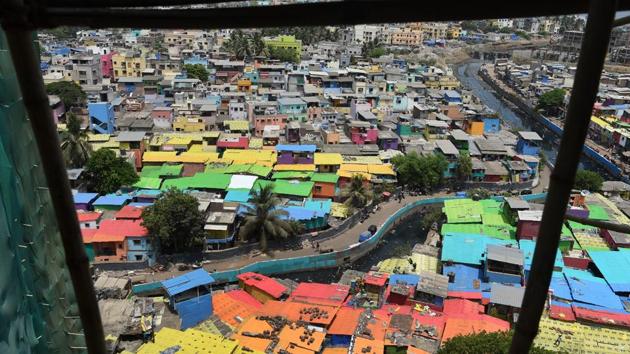 An view from up above shows houses painted in bright colours at a fishing locality in Mumbai, Maharashtra, on June 2, 2018. (Punit Paranjpe / AFP) An view from up above shows houses painted in bright colours at a fishing locality in Mumbai, Maharashtra, on June 2, 2018. (Punit Paranjpe / AFP)