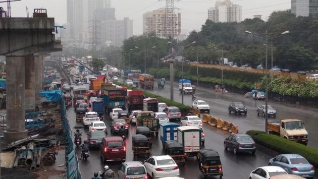 Traffic moves at slow pace on Western Express Highway due to the rains in Malad. The coastal districts of Sindhudurg, Ratnagiri, Raigad, Thane and Palghar also received heavy rains as the monsoon spread across the state bringing relief from the heat experienced in the past few weeks. (Pramod Thakur / HT Photo)