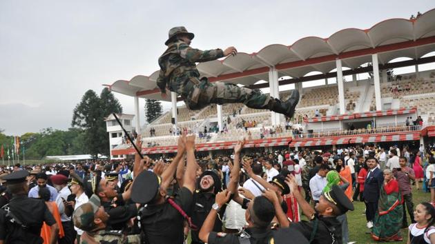 The newly commissioned officers toss a colleague up in air after the passing out parade of the gentleman cadets at IMA in Dehradun. (Vinay santosh Kumar/HT Photo) The newly commissioned officers toss a colleague up in air after the passing out parade of the gentleman cadets at IMA in Dehradun. (Vinay santosh Kumar/HT Photo)