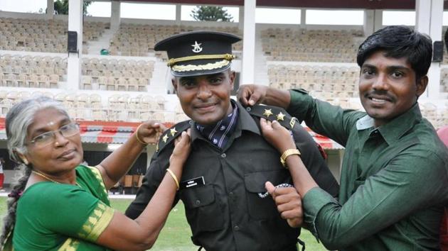 Rajshekhar with his mother and brother after the passing-out parade of the Indian Military Academy in Dehradun on Saturday.(HT/Vinay Santosh Kumar)