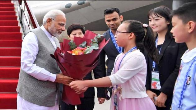 Prime Minister Narendra Modi being received in Qingdao, China on Saturday. He will be attenting the Shanghai Cooperation Organisation summit.(MEA/Twitter)