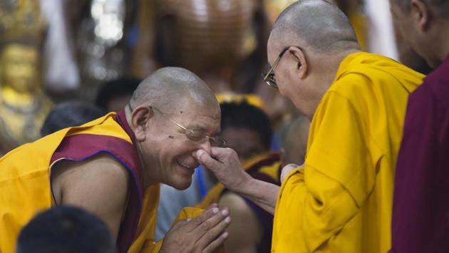 Tibetan spiritual leader the Dalai Lama playfully pinches the nose of a senior monk as he arrives to give a talk to Tibetan youth in Dharamshala, Himachal Pradesh on June 7, 2018. Every year the Tibetan leader speaks to young Tibetans to introduce them to Buddhist precepts. (Ashwini Bhatia / AP) Tibetan spiritual leader the Dalai Lama playfully pinches the nose of a senior monk as he arrives to give a talk to Tibetan youth in Dharamshala, Himachal Pradesh on June 7, 2018. Every year the Tibetan leader speaks to young Tibetans to introduce them to Buddhist precepts. (Ashwini Bhatia / AP)