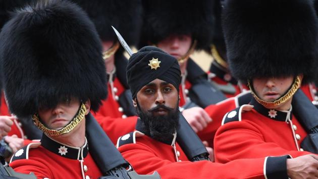 Guardsman Charanpreet Singh Lall of the Coldstream Guards wears a turban as he takes part in the Colonel's Review, the final rehearsal for Trooping the Colour, the Queen's annual birthday parade, in London, on June 2, 2018.(AP)