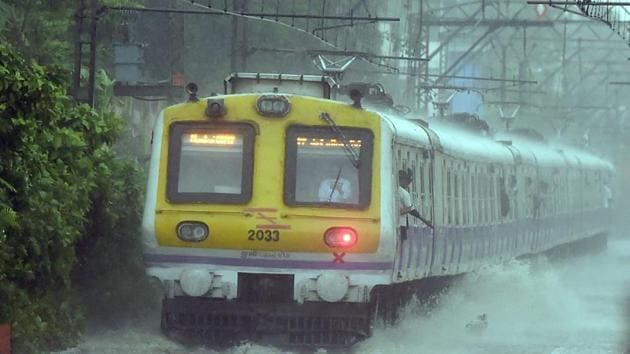 As Mumbai started receiving heavy rainfall following the onset of the Southwest monsoon many railway tracks were submerged under water. The suburban train services on the Central Railway were delayed by around 15 minutes, but the services on Western Railway remained largely unaffected by the rains. (Shashank Parade / PTI)