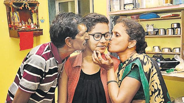 Gaurish Rajguru, daughter of a waste picker who secured 90.2 per cent, with her family. (Shankar Narayan/HT PHOTO) Gaurish Rajguru, daughter of a waste picker who secured 90.2 per cent, with her family. (Shankar Narayan/HT PHOTO)