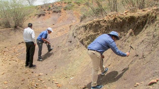 Members of the Geological Survey of India (GSI) and the National Trust for Art and Culture Heritage (INTACH) inspecting the Ramgarh Crater in Baran district of Rajasthan.(PTI)