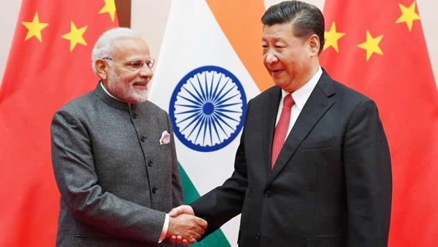 Narendra Modi shakes hands with Chinese President Xi Jinping during the 18th Shanghai Cooperation Organisation (SCO) Summit in Qingdao, China.(Reuters)