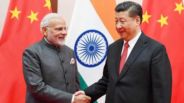 Prime Minister Narendra Modi greets Chinese President Xi Jinping during the 18th Shanghai Cooperation Organisation summit in Qingdao, China, on Saturday. (Reuters) Prime Minister Narendra Modi greets Chinese President Xi Jinping during the 18th Shanghai Cooperation Organisation summit in Qingdao, China, on Saturday. (Reuters)