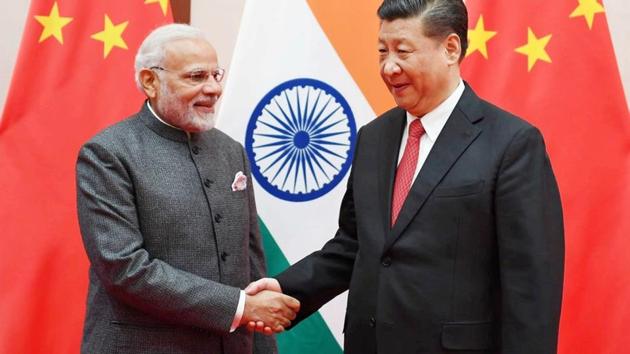 Prime Minister Narendra Modi shakes hands with Chinese President Xi Jinping during the 18th Shanghai Cooperation Organisation (SCO) Summit in Qingdao, China.(REUTERS)