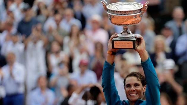 Spain's Rafael Nadal poses with the Mousquetaires Cup (The Musketeers) after his victory over Austria's Dominic Thiem, after the men's singles final match.(AFP)