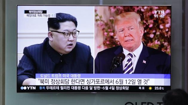 People watch a TV screen showing file footage of US President Donald Trump, right, and North Korean leader Kim Jong Un during a news program at the Seoul Railway Station in Seoul, South Korea.(AP file photo)