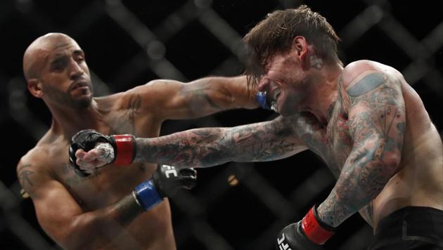 Mike Jackson (L) lands a punch on CM Punk during a welterweight UFC 225 Mixed Martial Arts bout Saturday, June 9, 2018, in Chicago.(AP)