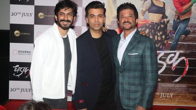 Harshvardhan Kapoor and Anil Kapoor flank producer Karan Johar. (Viral Bhayani) 