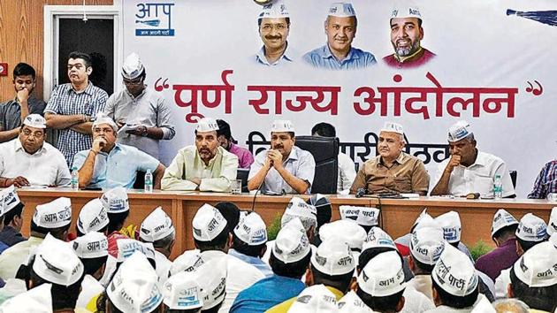 Delhi chief minister Arvind Kejriwal with deputy CM Manish Sisodia and Gopal Rai during a party meeting on statehood issue and Lok Sabha elections at his residence. (HT Photo) Delhi chief minister Arvind Kejriwal with deputy CM Manish Sisodia and Gopal Rai during a party meeting on statehood issue and Lok Sabha elections at his residence. (HT Photo)