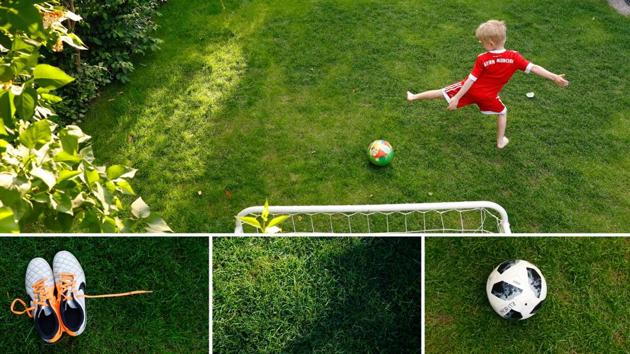 A boy plays soccer in a backyard garden in Vienna, Austria. On a floating pitch off the coast of Thailand or this prim garden with its own goalpost, football fever sweeps hearts and minds around the world. (Leonhard Foeger / REUTERS)