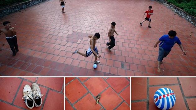 An outlined brick court in front of a temple in Hoang Xa village, outside Hanoi, Vietnam works just as well. No jerseys? It’s shirts versus skins in that case. (Kham / REUTERS)