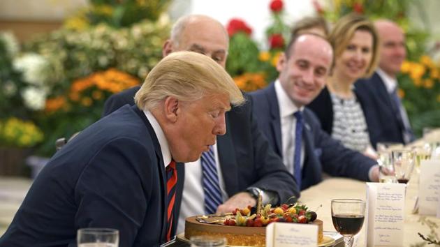 In this photo released by the Ministry of Communications and Information of Singapore, U.S. President Donald Trump blows out a candle on a cake celebrating an early birthday during lunch with Singapore's Prime Minister Lee Hsien Loong in Singapore, Monday, June 11, 2018. (AP) In this photo released by the Ministry of Communications and Information of Singapore, U.S. President Donald Trump blows out a candle on a cake celebrating an early birthday during lunch with Singapore's Prime Minister Lee Hsien Loong in Singapore, Monday, June 11, 2018. (AP)