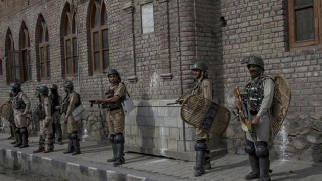 Paramilitary soldiers guard the streets in Srinagar. (AP File Photo) Paramilitary soldiers guard the streets in Srinagar. (AP File Photo)