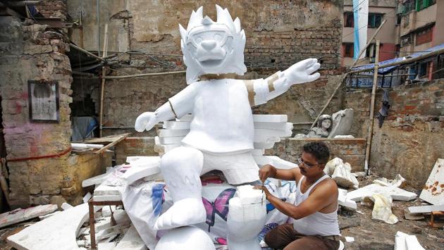 A man makes a replica of official mascot for the 2018 FIFA World Cup Russia at a workshop ahead of the FIFA World Cup in Kolkata. (Rupak De Chowdhuri / REUTERS)