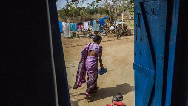 Fluoride can occur in drinking water naturally as a result of the geological composition of soil and bedrock but excessive intake affects teeth and bones. For Badepara village, rampant mining has meant increased fluoride in the water. Severe pain in her knees and ankles, and a gradual curvature in her backbone have made household chores difficult for 50-year-old Manbha Sohri as a result. (Prashanth Vishwanathan / WaterAid)