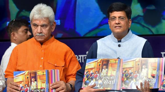 Railway minister Piyush Goyal and minister of state for railways Manoj Sinha release publications during a press conference on the achievements of the ministry in the last four years, in New Delhi on Monday.(PTI Photo)