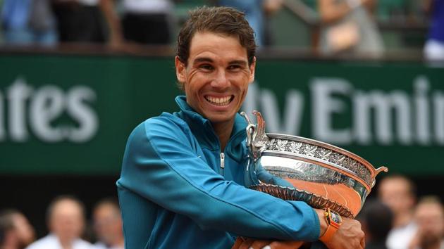 Spain's Rafael Nadal poses with the Mousquetaires Cup (The Musketeers) after his victory in the men's singles final match against Austria's Dominic Thiem, Paris, June 10, 2018(AFP)