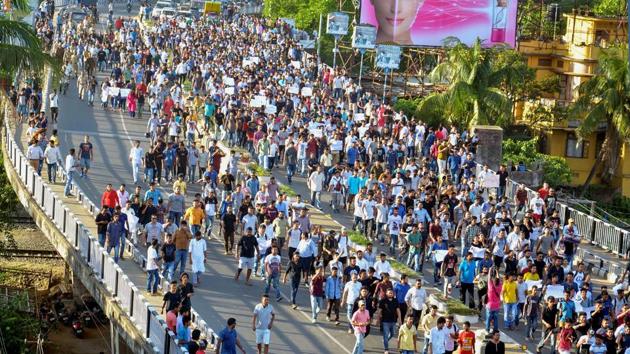 People during a protest rally against unidentified people responsible for lynching two men in Assam’s Karbi Anglong district in Guwahati on June 10.(PTI Photo)