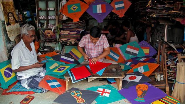 Kite-makers make kites with pictures of the national flags of the countries participating in the upcoming FIFA World Cup in Russia, at a workshop in Kolkata, India. (REUTERS)