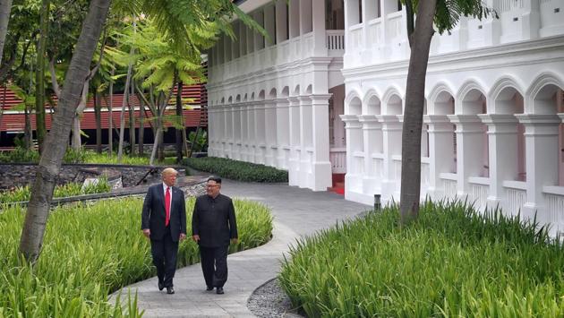 The two leaders stroll post working lunch at the Capella Hotel. Trump also showed Kim Jong Un the interior of the presidential limousine known as ‘The Beast’ during their stroll. (Kevin Lim / The Straits Times via REUTERS)