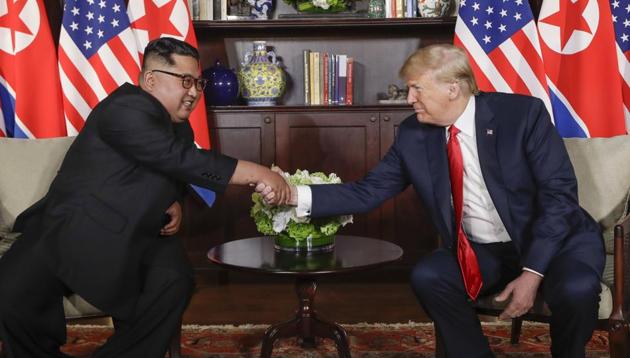 US President Donald Trump shakes hands with North Korea leader Kim Jong Un during their first meetings at the Capella resort on Sentosa Island Tuesday, June 12, 2018 in Singapore.(AP)