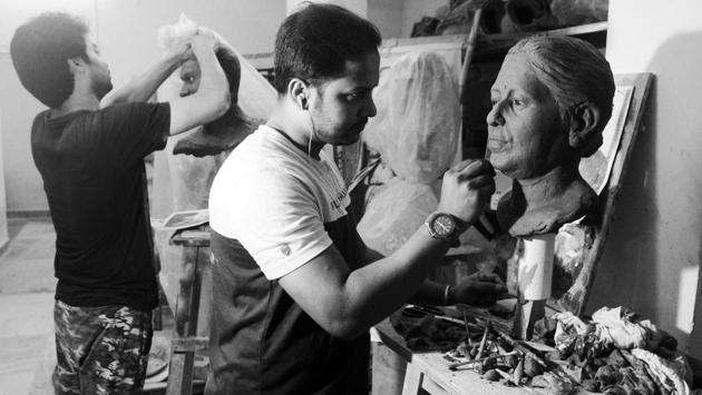 Artists work on clay bases for sculptures. These models are the first step in an elaborate and painstakingly detailed project. Once clay has been fleshed out into a desired character, fiberglass or rubber is used to make a mould. The exterior is finally covered in silicone, giving it a skin like feel. (Samir Jana / HT Photo) Artists work on clay bases for sculptures. These models are the first step in an elaborate and painstakingly detailed project. Once clay has been fleshed out into a desired character, fiberglass or rubber is used to make a mould. The exterior is finally covered in silicone, giving it a skin like feel. (Samir Jana / HT Photo)