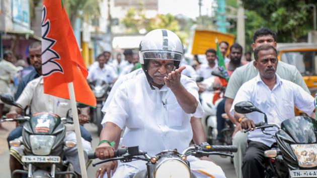 Union minister and BJP leader Pon Radhakrishnan leads a bike rally to celebrate 4 years of the party's government at the Centre in Nagercoil, Tamil Nadu on Tuesday. (PTI)