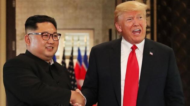 US President Donald Trump and North Korea's leader Kim Jong Un shake hands after signing documents during the US-North Korea summit at the Capella Hotel on the resort island of Sentosa, Singapore on June 12.(REUTERS)