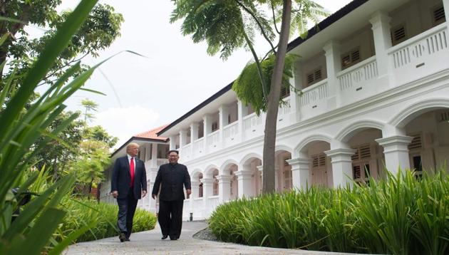 North Korea's leader Kim Jong Un (R) walks with US President Donald Trump (L) during a break in talks at their historic US-North Korea summit, at the Capella Hotel on Sentosa island in Singapore on June 12, 2018. (AFP) North Korea's leader Kim Jong Un (R) walks with US President Donald Trump (L) during a break in talks at their historic US-North Korea summit, at the Capella Hotel on Sentosa island in Singapore on June 12, 2018. (AFP)