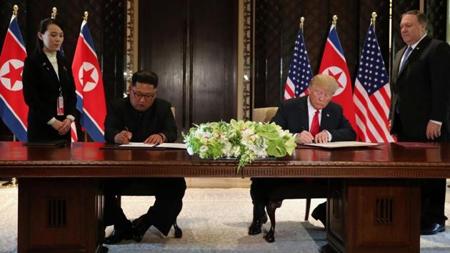 “We had a historic meeting and decided to leave the past behind and we’re about to sign a historic document. The world will see a major change. I want to express my gratitude to President Trump for making this meeting happen,” said Kim Jong Un as he signed a document with Trump. The two leaders were flanked by Kim’s sister Kim Yo Jong and US Secretary of State Mike Pompeo. (Jonathan Ernst / REUTERS)