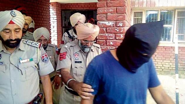 One of the arrested followers of Dera Sacha Sauda who were sent to four-day police remand, at CJM court in Moga on Tuesday.(HT Photo)