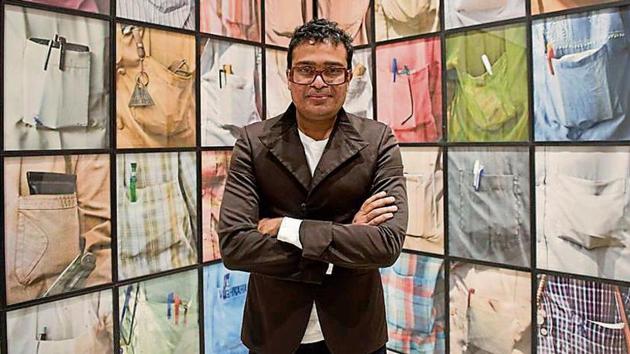 Mumbai-based artist Jitish Kallat with his works. (HT File) Mumbai-based artist Jitish Kallat with his works. (HT File)